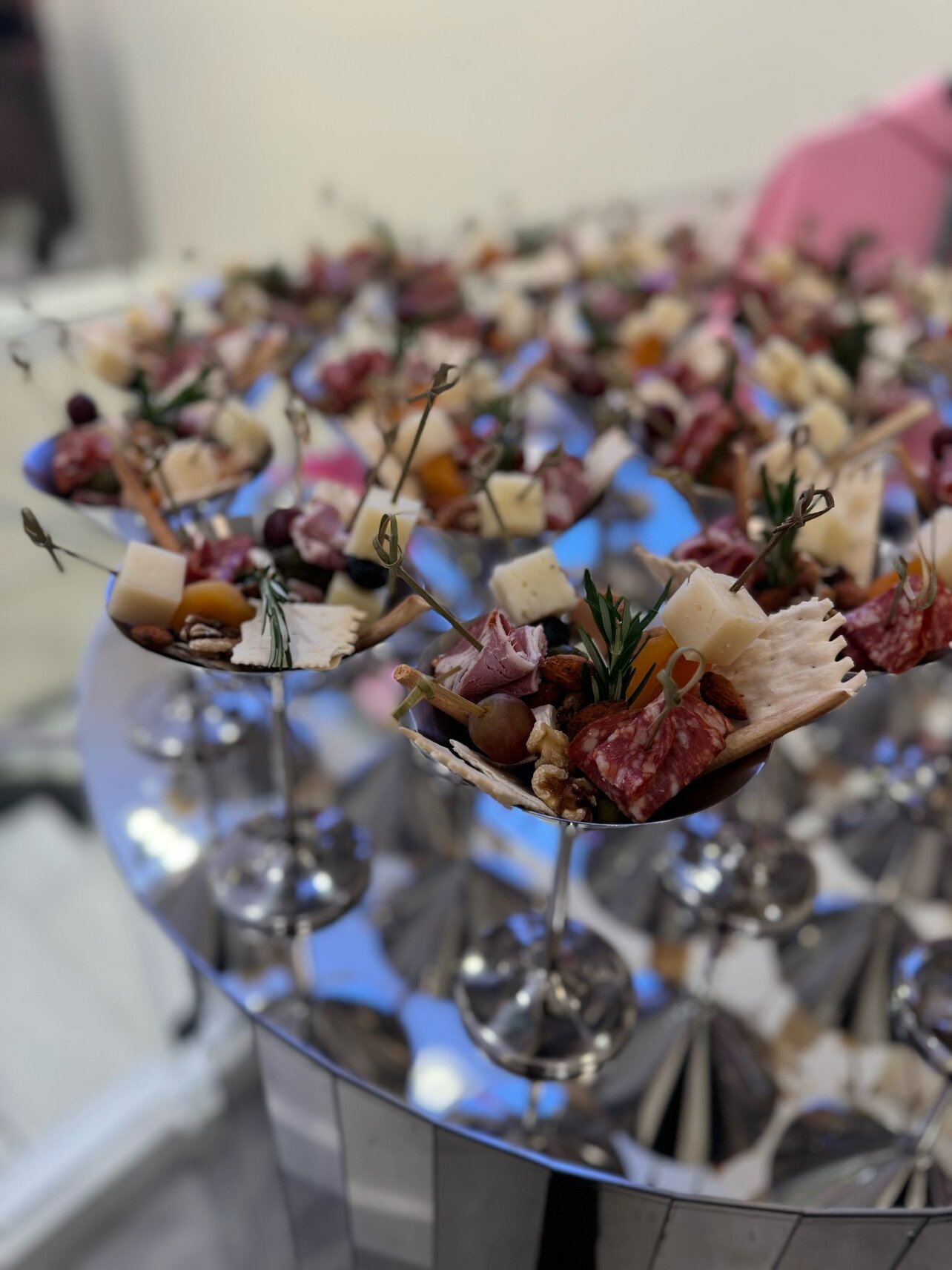 Charcuterie cones arranged on a mirrored table