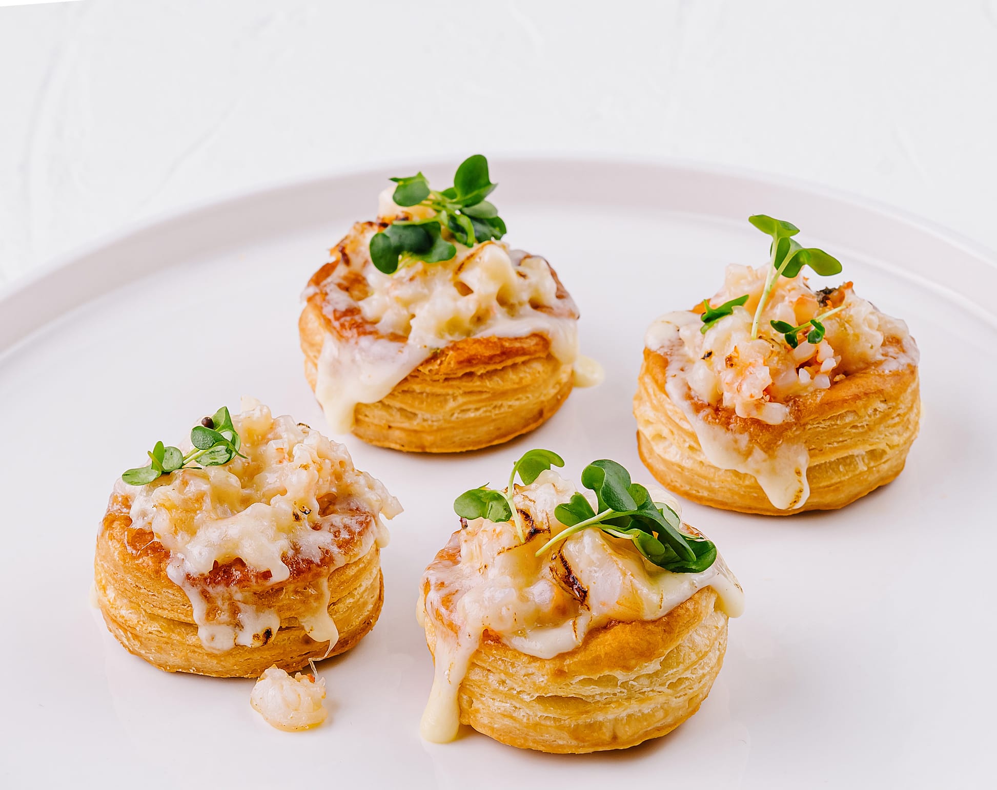Seafood vol-au-vent canapes with microgreens