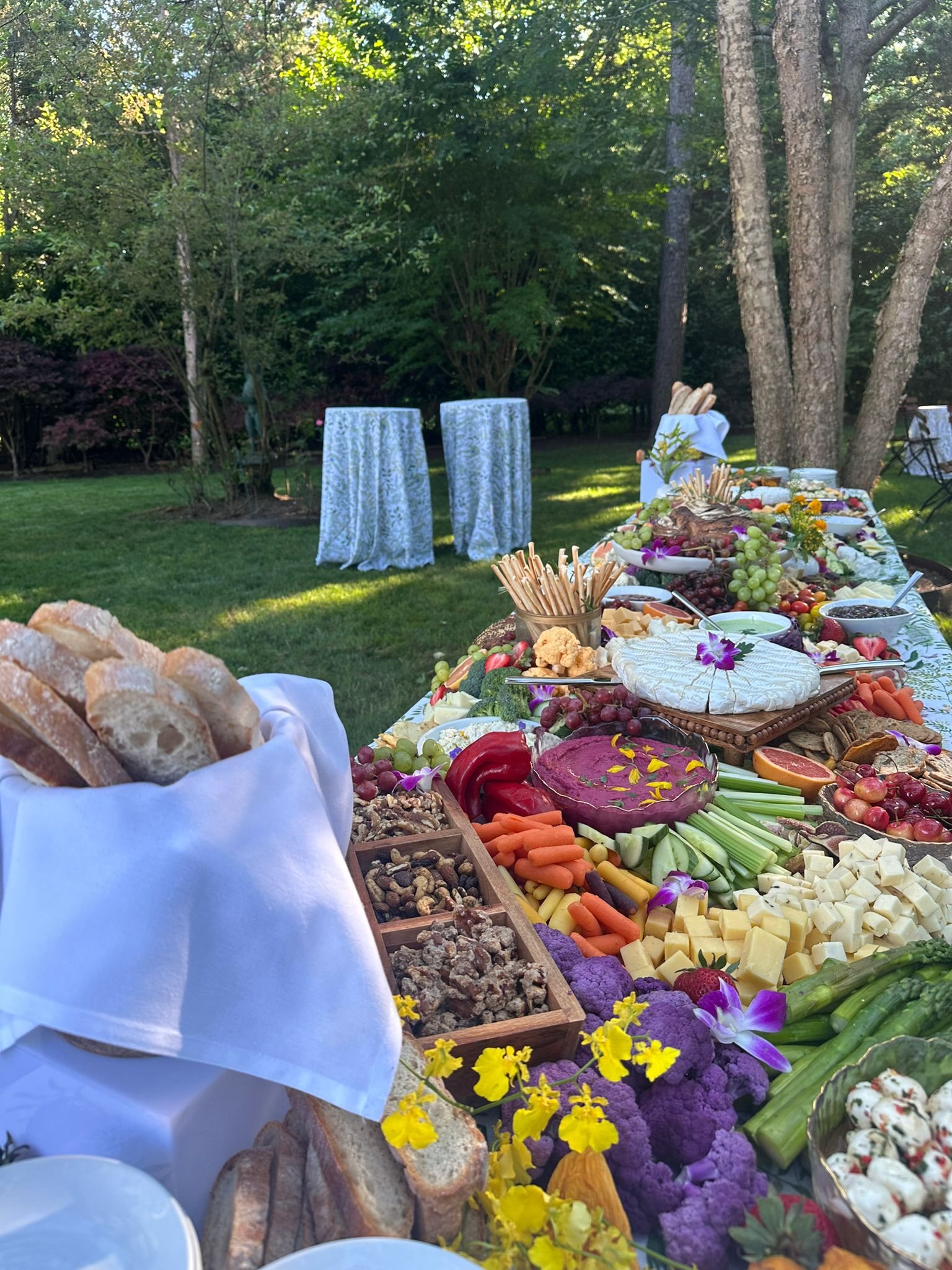 Garden grazing table at an outdoor celebration